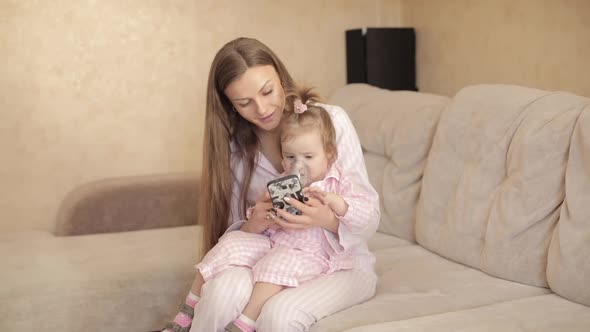 Mom Treating Child During Illness and Showing Cartoons