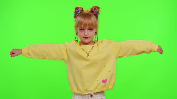 Happy Little Kid Girl Blogger Front of Phone Camera Record Video Enjoy Dance Content on Chroma Key alt