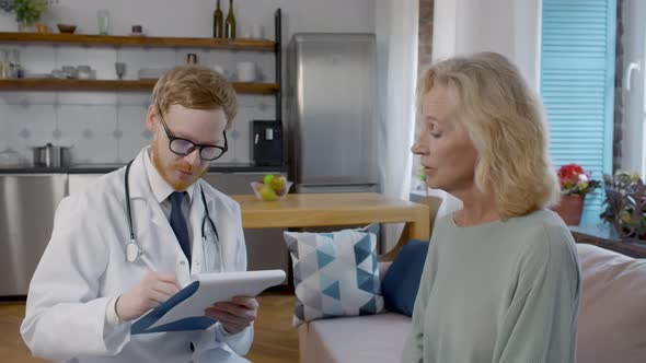 Young Doctor Visiting Old Mature Woman for Check-up alt