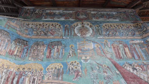 Detail Of Murals In Blue Exterior Walls Of Voronet Monastery In Suceava, Romania alt
