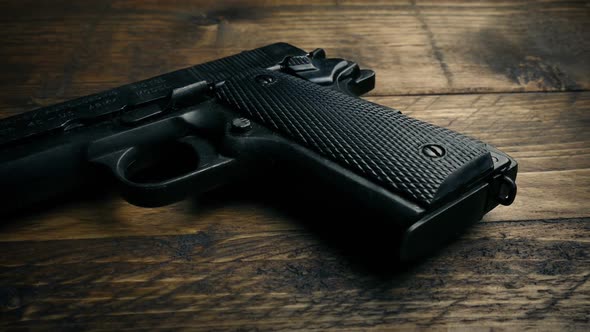 Passing Hand Gun On Table, Stock Footage | VideoHive