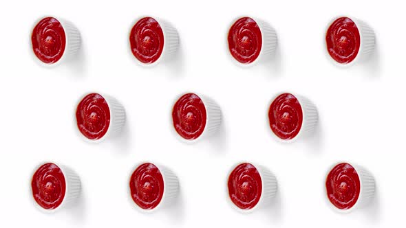 Vertical Stop Motion Animation with Ketchup and Mayonnaise Sauces on White Background