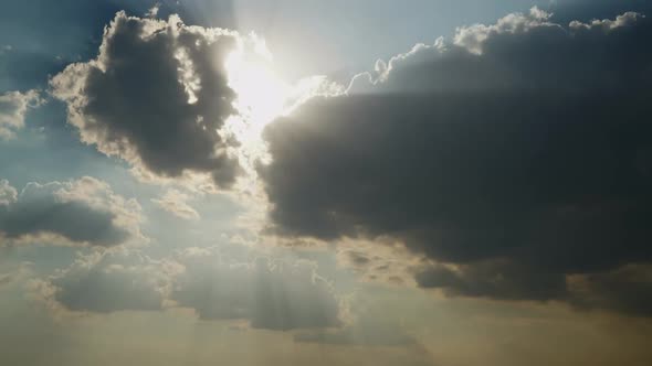 8K Sunbeams And Sun Rays Behind The Clouds