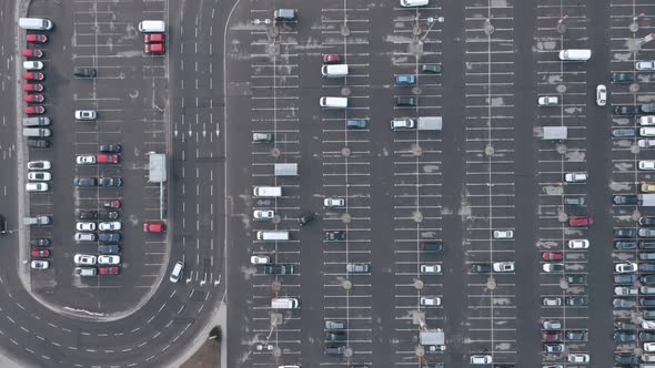 AERIAL: Traffic near Half Empty Parking Lot
