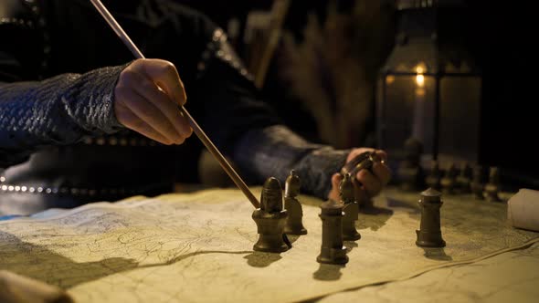 Commander in the Middle Ages.Compass and map in the historical age. alt