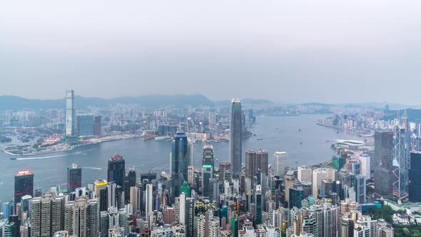 Timelapse of city skyline from day to night in hong kong china alt