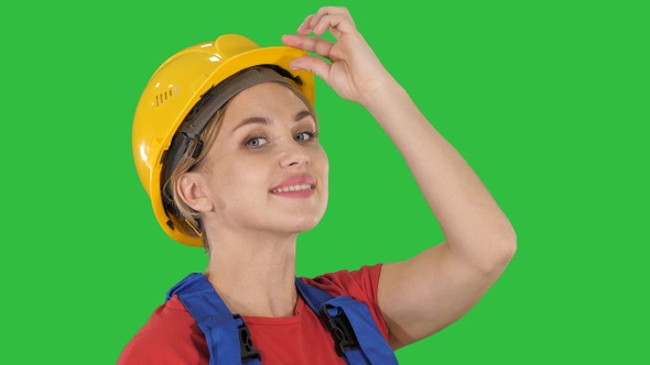 Female construction worker greeting on a Green Screen, Chroma Key alt