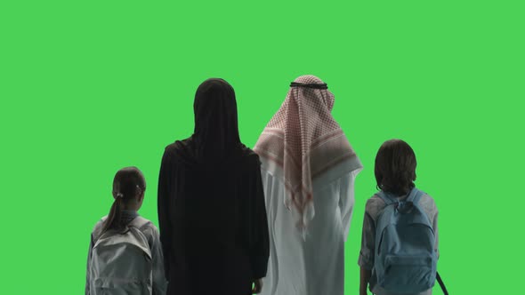 Arabic Adult Parents with two Children walking