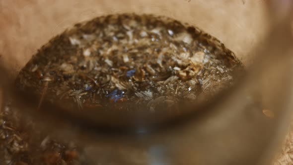 Closeup View of Aromatic and Relaxing Infusion of Tea From Sri Lanka in a Transparent Teapot alt