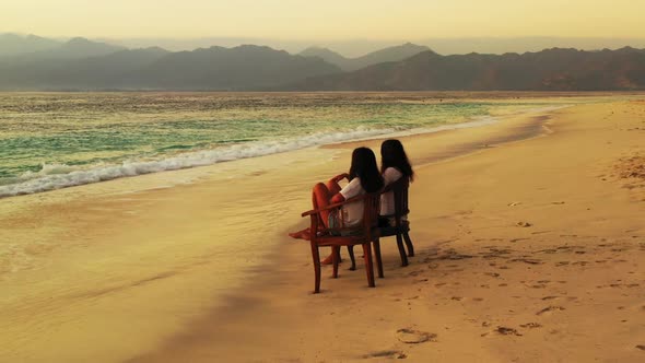 Ladies together happy together on relaxing bay beach holiday by blue lagoon with bright sand backgro alt