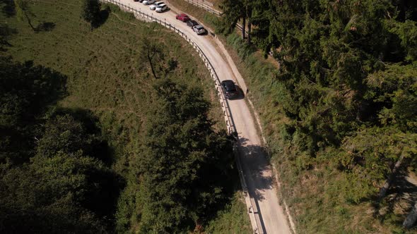 Black car drives to the Restaurant on mountain Brè in Lugano, Ticino, aerial alt