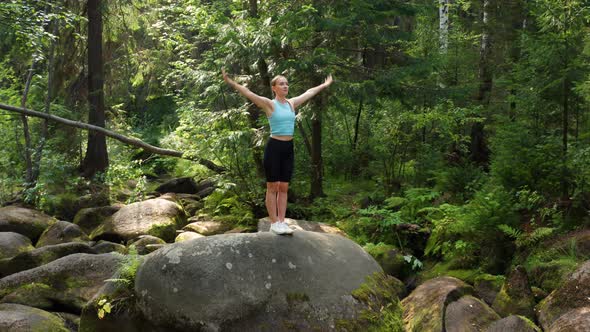 A Girl Practices Yoga in the Jungle alt