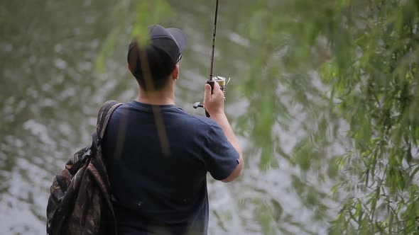A Man Fishing on the Lake