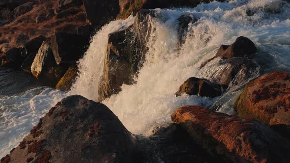 River and Cascades of Dynjandi Falls at Sunset Westfjords Iceland alt