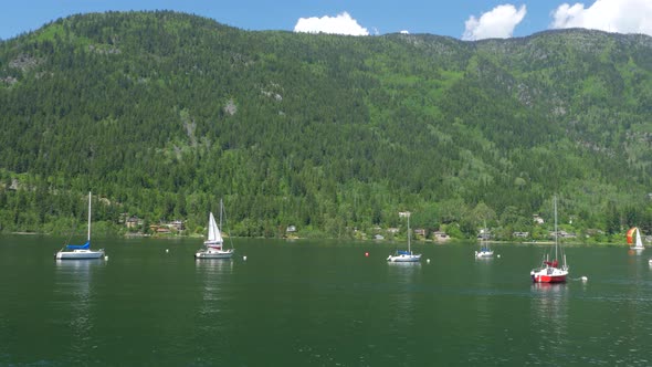 Pan Across Beautiful Kootenay Lake In Nelson In The Summer With Sail Boats 01