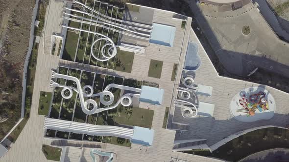 Aerial view of closed aqua park on the hill, empty pools and slides, no people, Budva, Montenegro  alt