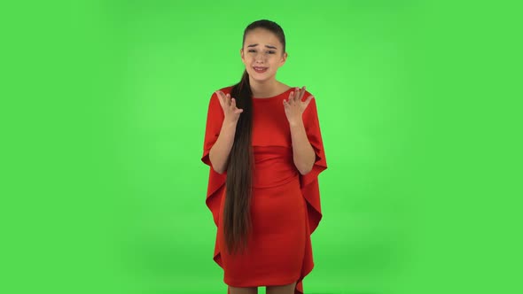 Pretty Young Displeased Woman Is Indignantly Talking To Someone, Then Cries. Green Screen alt