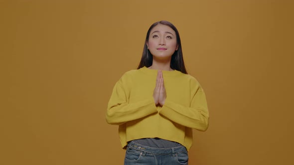 Young Adult Looking Up and Praying for Meditative Concept alt