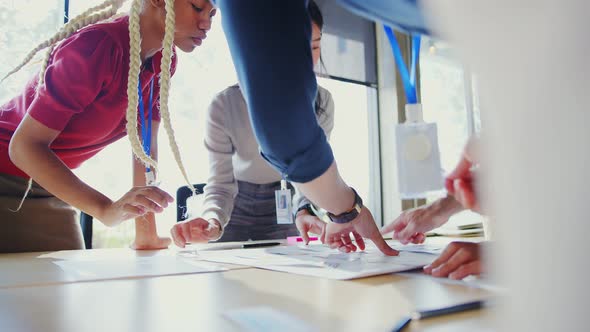 Meeting of UX developer and UI designer brainstorming about mobile app interface workflow alt