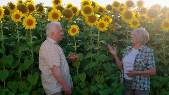 And Elderly Couple Both Wearing Checkered Blouses alt