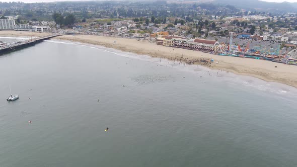 Start of a triathlon on the shore of the beach with a group of athletes doing the swimming activity alt