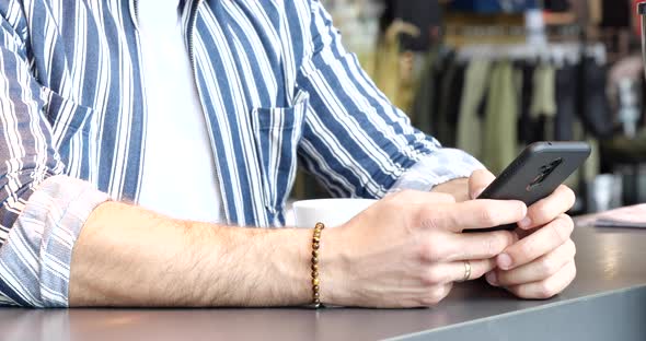 Technology Concept Close Up of Hands Typing on Smartphone 