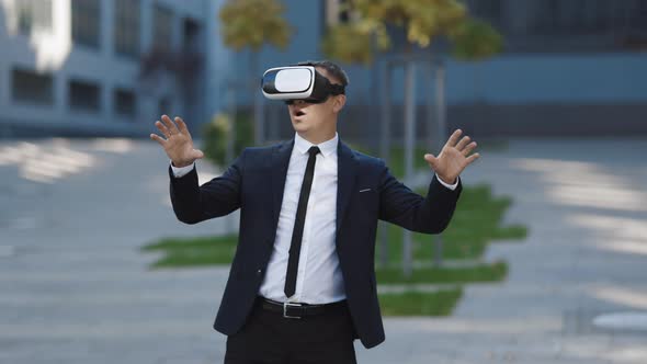Businessman Touch Something Using Modern 3D VR Glasses Near Office Building alt