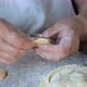 Elderly Woman Hands Making Vegetarian Dumplings with Roasted Cabbage - VideoHive Item for Sale
