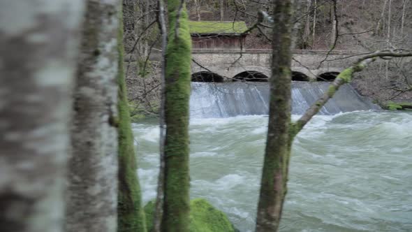 Pan shot Water flowing from the dam channel. view of the river channel. video of water waves from an alt