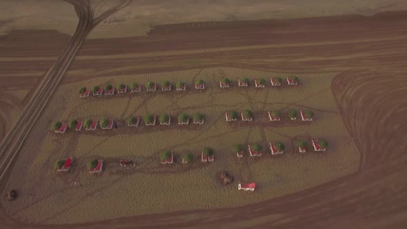Beach with Deck-chairs and Blue Ocean, Aerial View alt