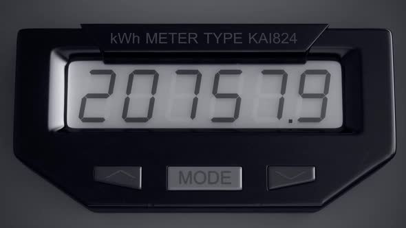 Digital electricity meter showing household consumption in kilowatt hours. alt