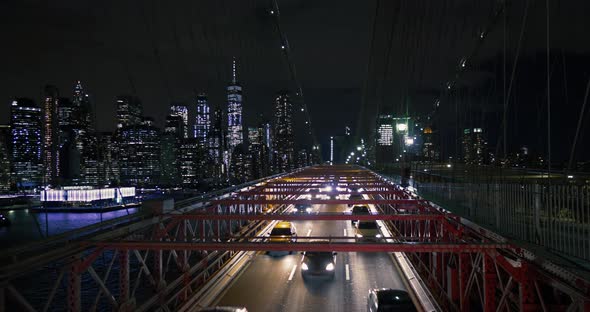 Cars Driving at Night on Brooklyn Bridge New York City
