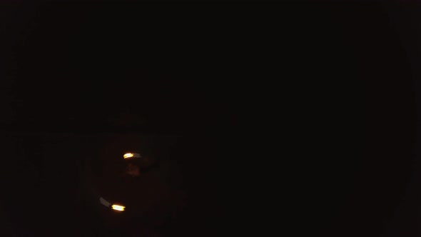 Young Blond Male Does Fire Dance with Two Torches Spins Burning Torches alt