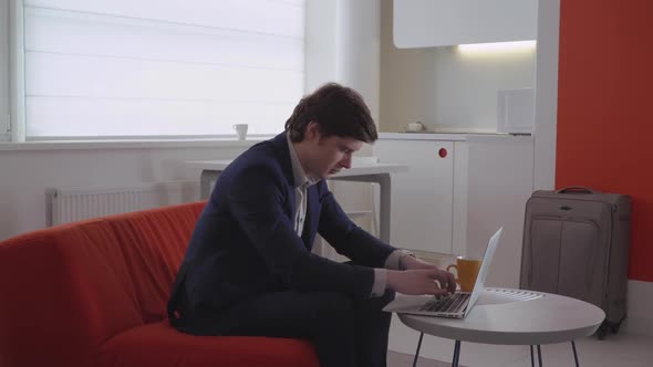 Guy Finalizing Presentation for Client. alt