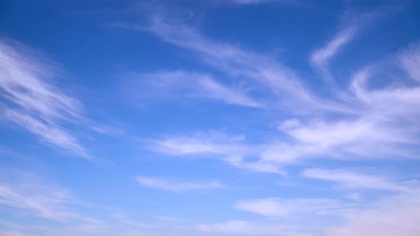 Blue sky with thin cirrus clouds timelapse, daytime landscape