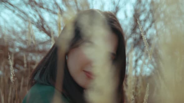 Young Brunette Among the Reeds