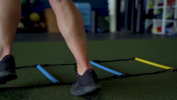 Close up of females feet performing gym ladder sprints alt