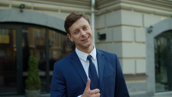 Portrait of Smiling Business Man Posing at City Street. Successful Executive Man alt