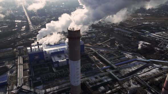 Emission carbon gases from factory pipes with smoke in atmosphere alt