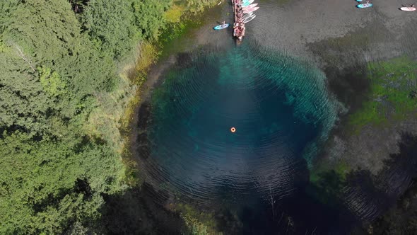 People Tourists Resting Near the Blue Clear Lake alt