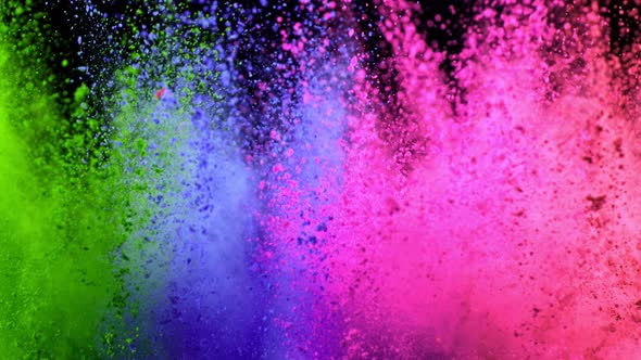 Super Slowmotion Shot of Color Powder Explosion Isolated on Black Background alt