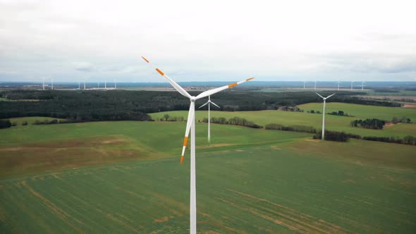 Drone Rising Above Large Windmill Turbine with Red Blade Stripes, Alternative Sustainable Eco Energy alt