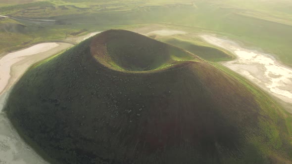 Dried caldera lake among bigger lake from air