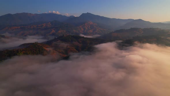 4K Aerial view of Mountains landscape with morning fog. alt