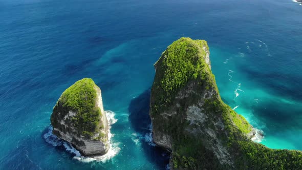 Drone Shot By Drone Ocean with Waves and Rocky Cliff Bali, Indonesia. Aerial View of Big Blue Sea