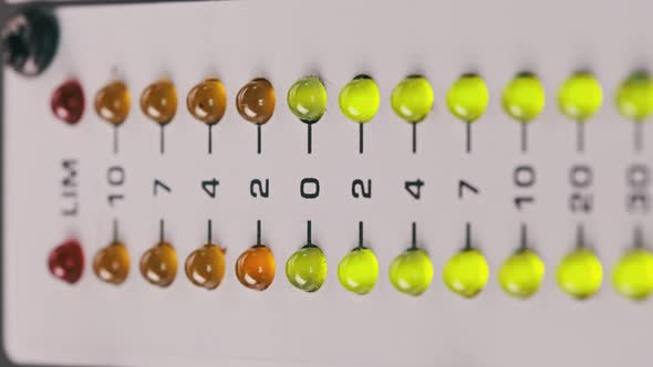 Vertical Video Macro Shot of Stereo LED Indicator on Mixing Console alt