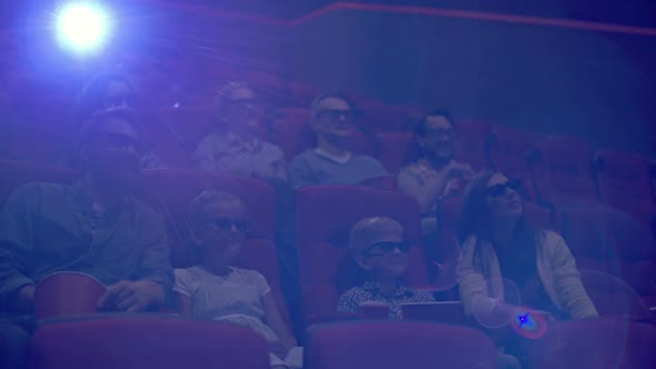 Parents and Kids Watching 3D Movie alt