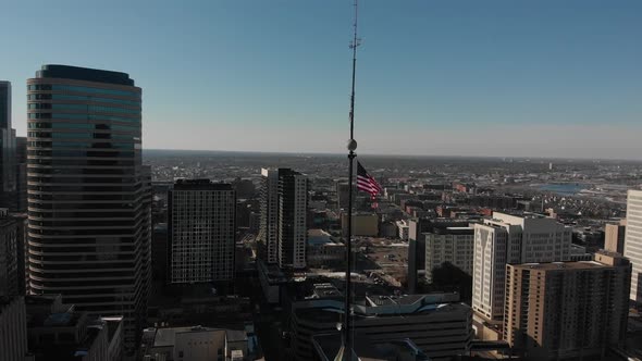 aerial footage American flag above buildings at downtown Minneapolis alt