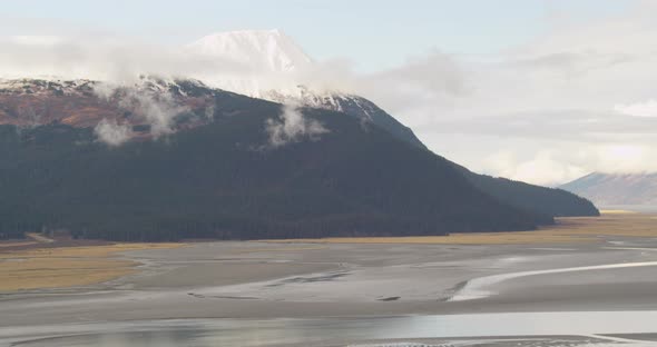 Aerial overhead tracking shot of Troopers helicopter flying above icebergs, drone footage