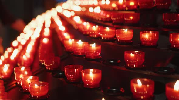 Lots of Candles Burning in Catholic Church